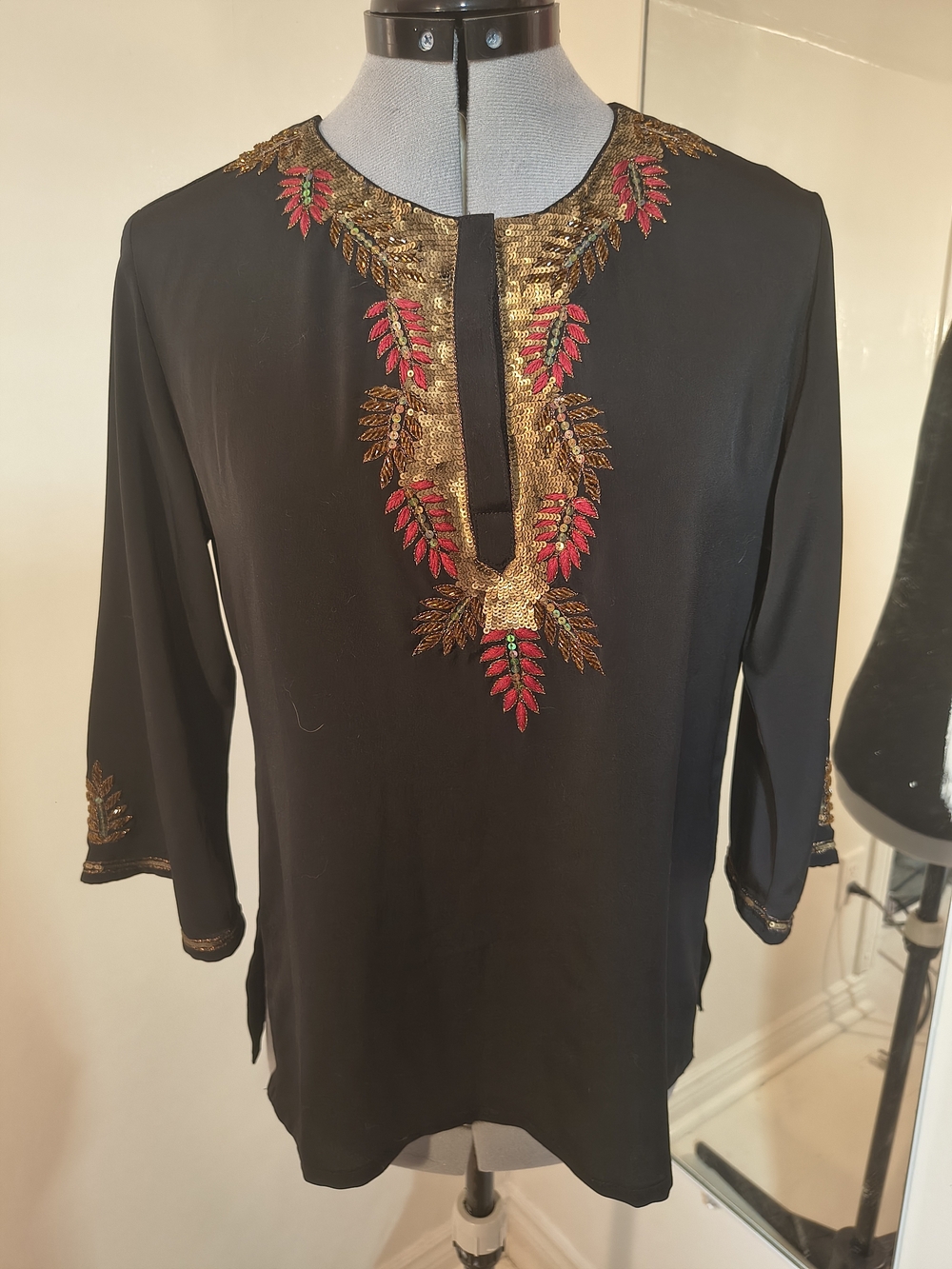 Lakshita Black Top with Gold Script Label & Red Accent